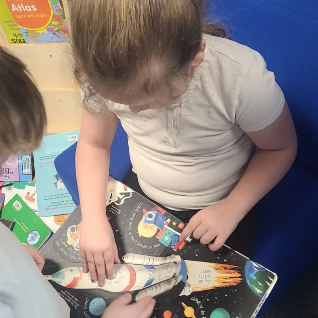 T and C were sharing a story, they were fascinated in lifting the different flaps and learning about space. #BeechClass #ReadingEuler